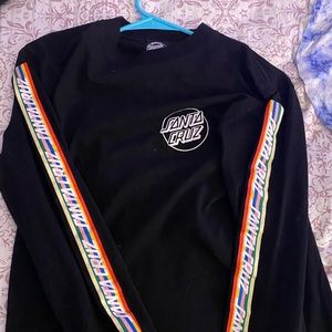 Black long sleeve Tee with colorful sleeves.